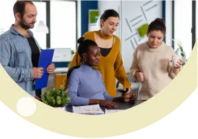 Diverse business team collaborating in a modern office, fostering creative problem-solving.
