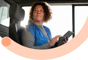 Professional driver in delivery vehicle taking pride in quality service.