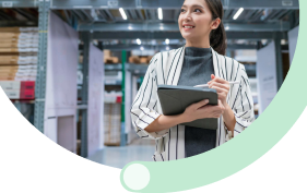 Field sales representative with tablet conducting inventory management in modern warehouse facility