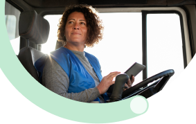 Professional woman operating delivery van for automated van sales logistics solutions