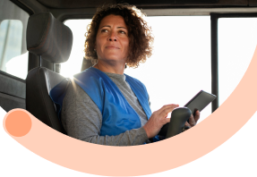 True Ownership: Professional woman driver in delivery vehicle taking pride and ownership in quality logistics service delivery