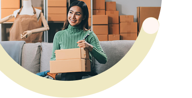 Scale Without Breaking the Bank: Female business manager using laptop in warehouse environment for cost-effective scaling and efficient operations management