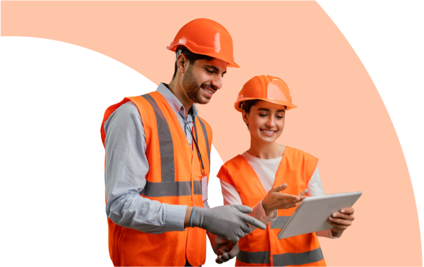 Work With Us: Two workers looking at a tablet discussing something